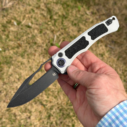 Heretic Blizzard Wraith V4 SE Manual Knife – 3.7″ MagnaCut Battleworn Black Blade, Blue Titanium Collar – Made in USA