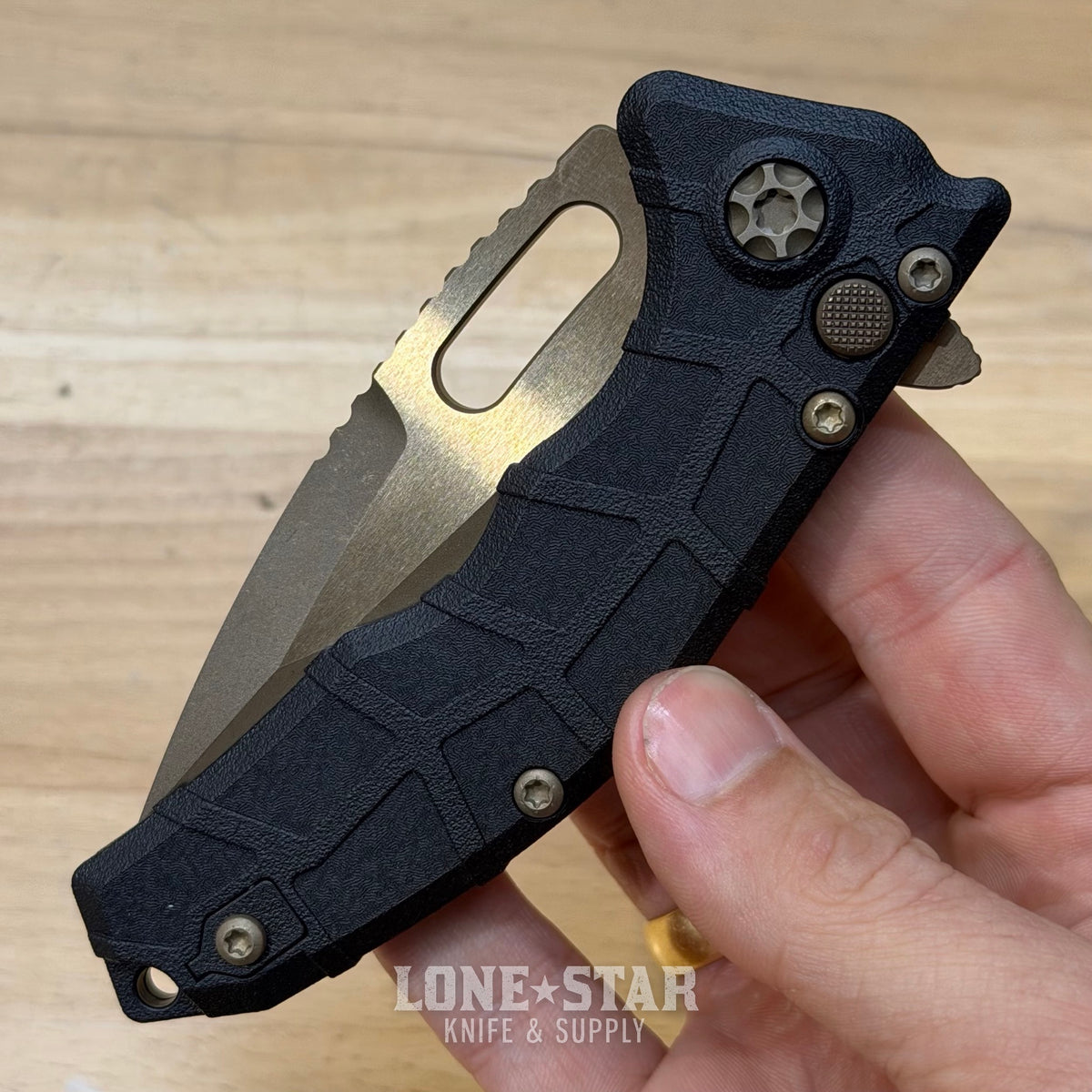 Heretic Martyr Tanto Manual Knife - Black Polymer, 3.5" Bronze MagnaCut Tanto, Button Lock - Made in USA (H057-7A)