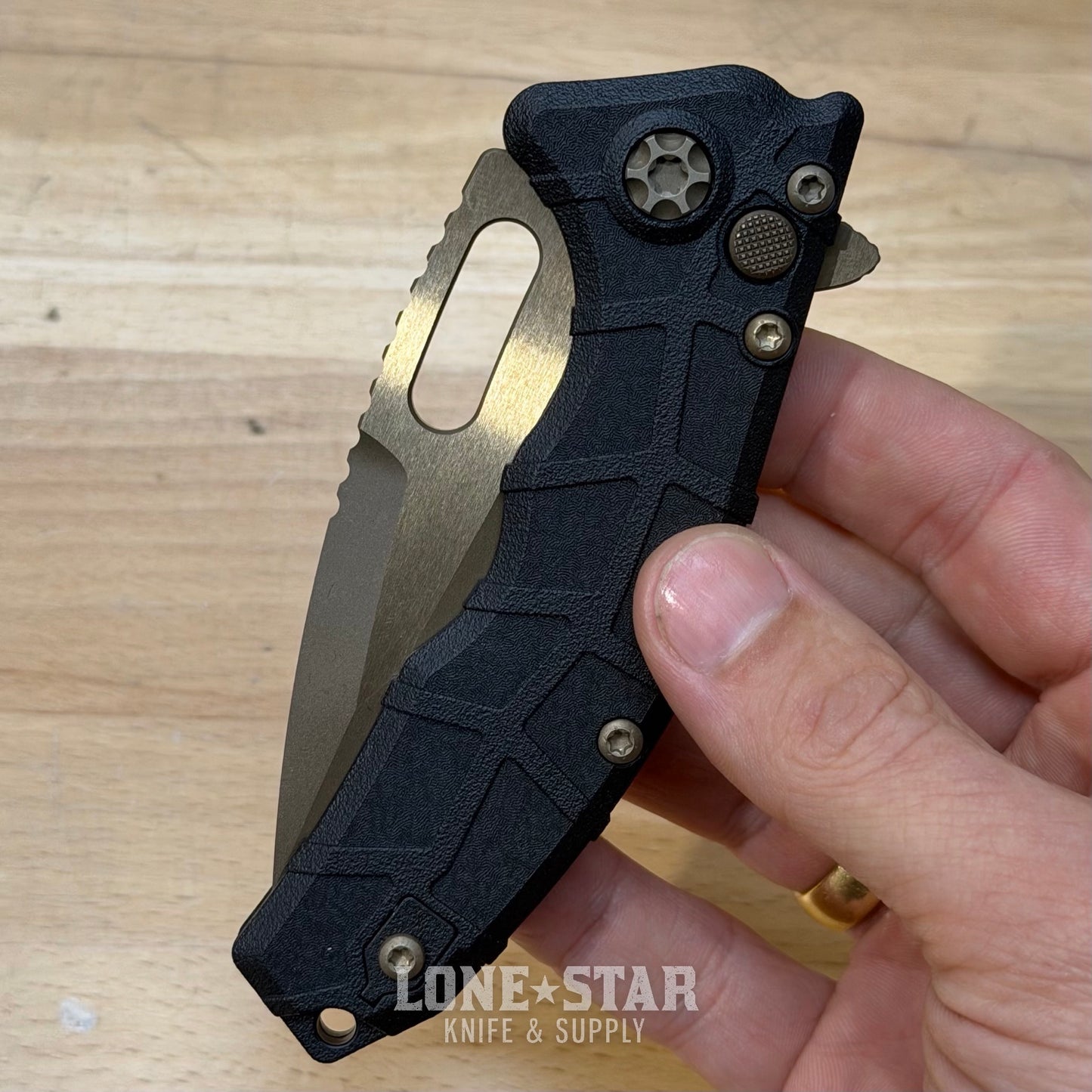 Heretic Martyr Tanto Manual Knife - Black Polymer, 3.5" Bronze MagnaCut Tanto, Button Lock - Made in USA (H057-7A)