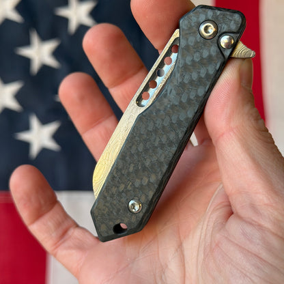 Heretic Knives Jinn Manual Knife – Carbon Fiber Chassis, Vegas Forge Vines & Roses Damascus, Hand Ground Polished Blade, Flamed Titanium Clip – Serialized – Made in USA (S/N 017)