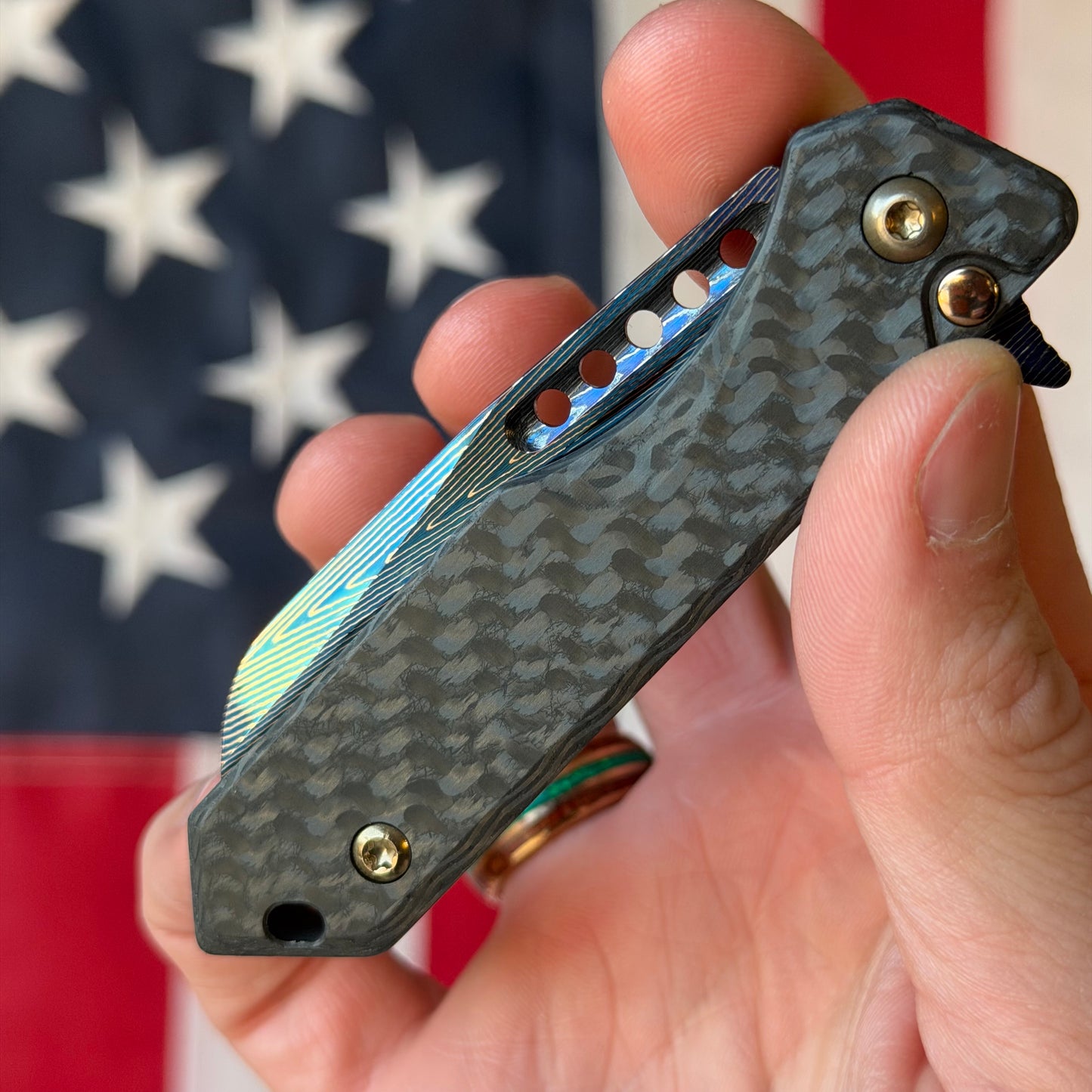 Heretic Knives Jinn Manual Knife – Carbon Fiber Chassis, Vegas Forge Herringbone Damascus, Hand Ground Blued Blade, Flamed Titanium Clip – Serialized – Made in USA (S/N 022)