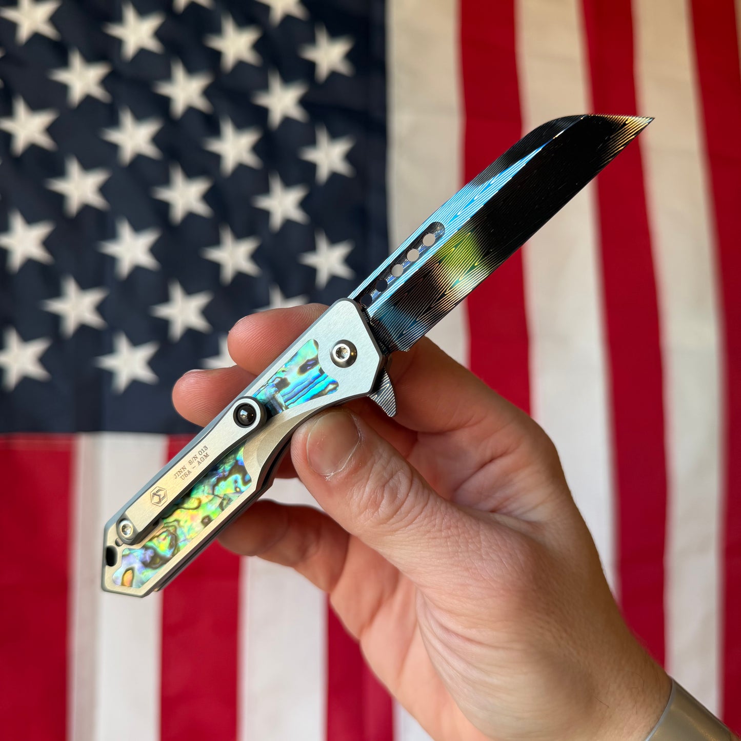 Heretic Knives Jinn Manual Knife – Titanium Chassis, Vegas Forge Herringbone Damascus, Hand Ground Blued Blade, Abalone Inlays – Serialized – Made in USA (S/N 013)