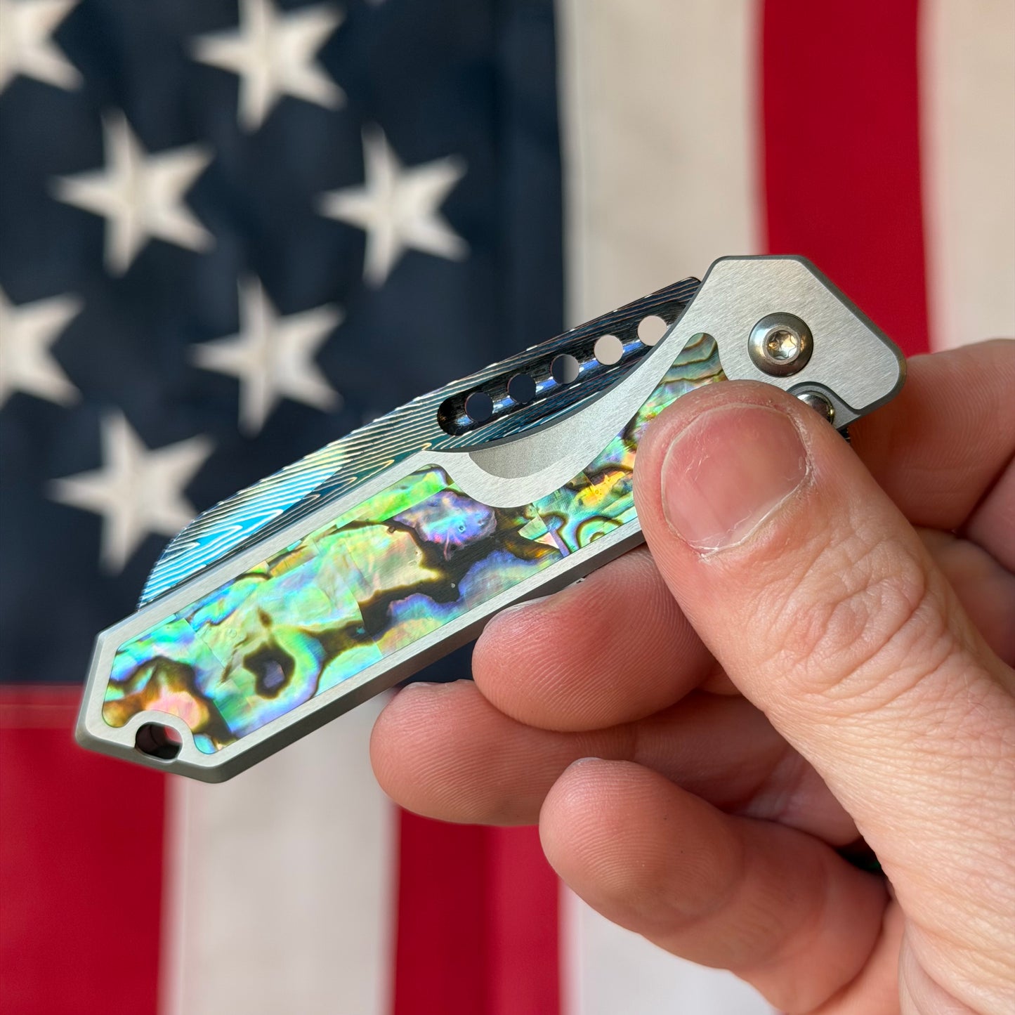 Heretic Knives Jinn Manual Knife – Titanium Chassis, Vegas Forge Herringbone Damascus, Hand Ground Blued Blade, Abalone Inlays – Serialized – Made in USA (S/N 013)