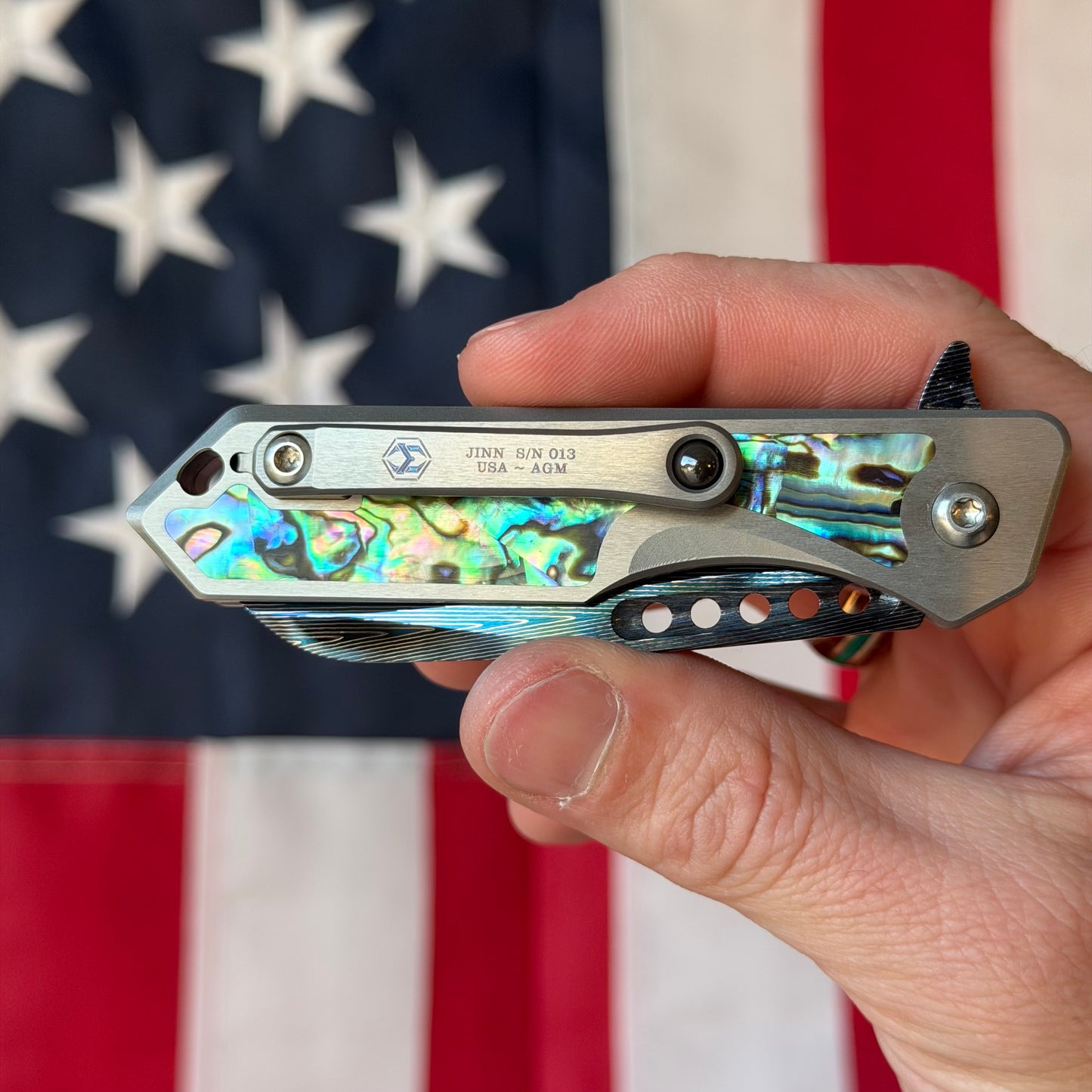 Heretic Knives Jinn Manual Knife – Titanium Chassis, Vegas Forge Herringbone Damascus, Hand Ground Blued Blade, Abalone Inlays – Serialized – Made in USA (S/N 013)