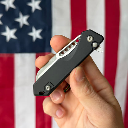 Heretic Jinn Manual 3.0" Button Lock Flipper – Battleworn MagnaCut, Black Chassis – Made in USA (H213-5A)