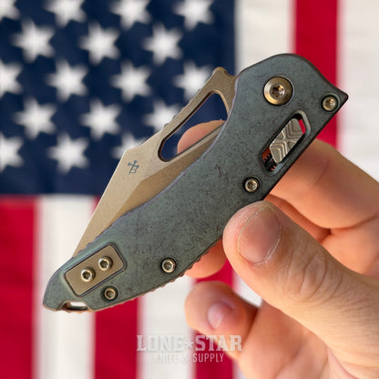 Microtech M-Stitch Ram-Lok, Marfione Select Antique Denim Titanium with Bronze Accents, Full Serrated 3.05" M390MK Bronzed Stonewash, Blade Show West 2026, Made in USA (169MRL-15MS3)