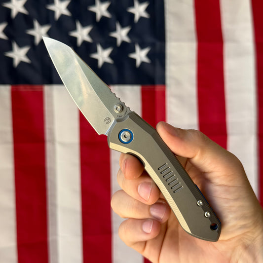 Millit Overland Folder 3.17″ Ti Frame Lock – Full Titanium Handle, Blue Backspacer & Pivot Collar, Magnacut Sheepsfoot – Made in USA