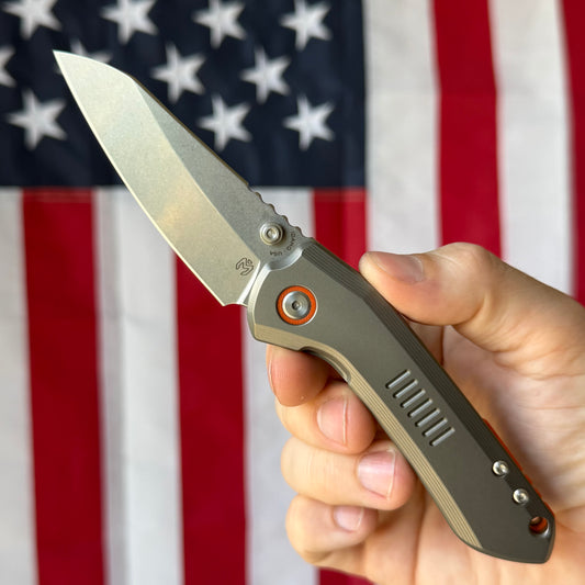 Millit Overland Folder 3.17″ Ti Frame Lock – Full Titanium Handle, Orange Backspacer & Pivot Collar, Magnacut Sheepsfoot – Made in USA