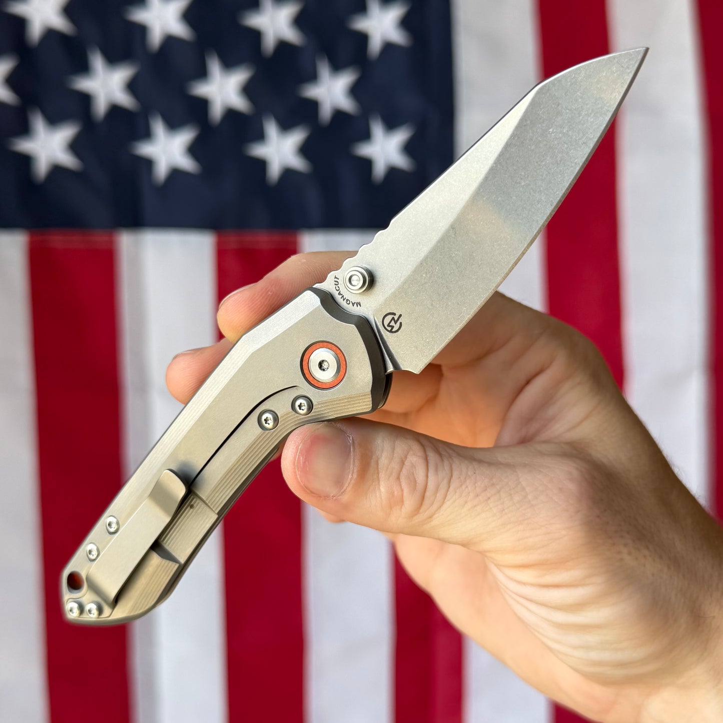 Millit Overland Folder 3.17″ Ti Frame Lock – Full Titanium Handle, Orange Backspacer & Pivot Collar, Magnacut Sheepsfoot – Made in USA
