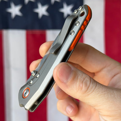 Millit Overland Folder 3.17″ Ti Frame Lock – Full Titanium Handle, Orange Backspacer & Pivot Collar, Magnacut Sheepsfoot – Made in USA