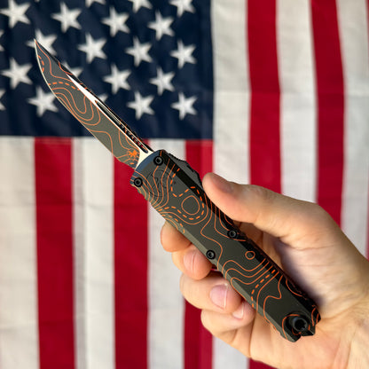 Microtech Ultratech Gen IV 3.46" OTF S/E – Topographic Black/Orange Camo, M390MK – Made in USA (11214-1TPBKORCS)