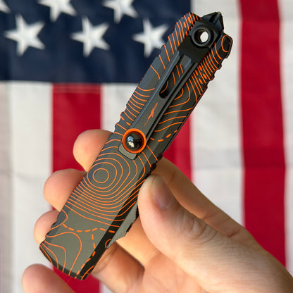 Microtech Ultratech Gen IV 3.46" OTF S/E – Topographic Black/Orange Camo, M390MK – Made in USA (11214-1TPBKORCS)