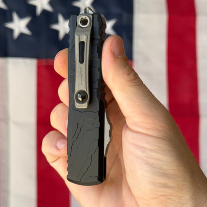 Microtech UTX-85 Gen IV Signature Series 3.11" OTF – Interceptor Blade, Black Topographic Deep Engraved Handle, M390MK Apocalyptic – BSA26 – Made in USA (12354TP-10APS)