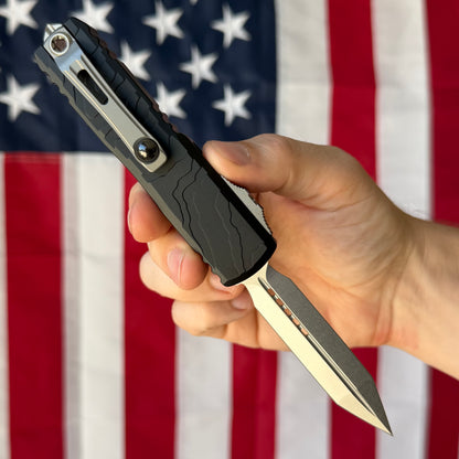 Microtech UTX-85 Gen IV 3.11" OTF – Spartan Blade, Black Topographic Deep Engraved Handle, M390MK Stonewash – BSA26 – Made in USA (12304TP-10)