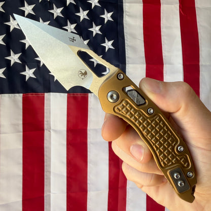 Microtech M-Stitch RAM-LOK 3.05" Manual – Tan Frag Aluminum, M390MK Stonewash – Made in USA (169MRL-10FRTA)