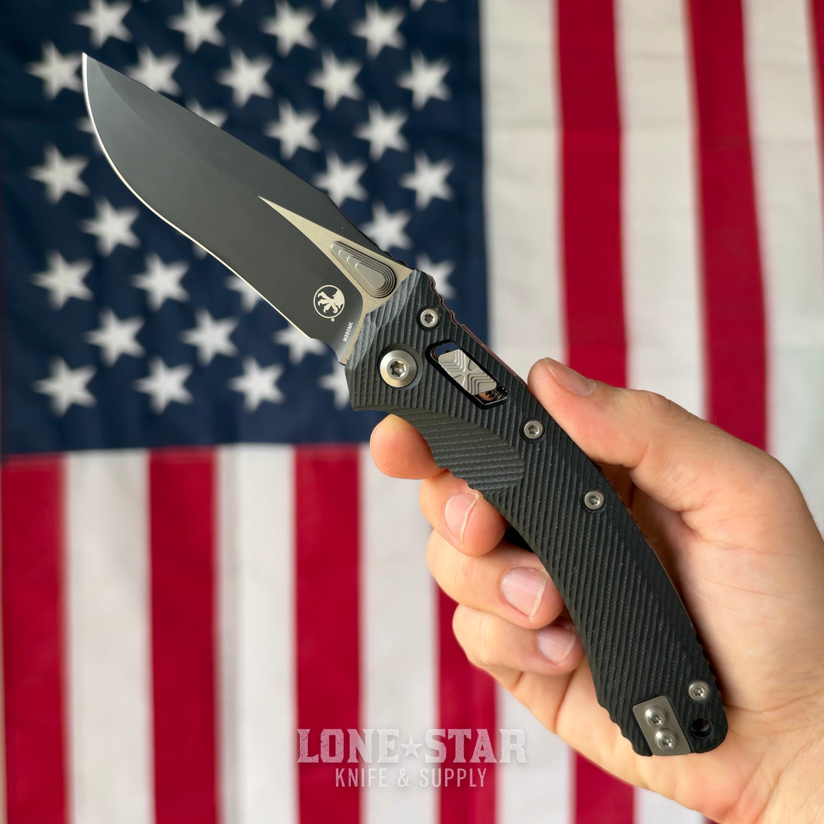 The Back Door: Microtech Amphibian Ram-Lok Manual Folder, 3.9" Two-Tone Black M390MK, Black Fluted G10 - Made in USA (137RL-1FLGTBK) (Used)