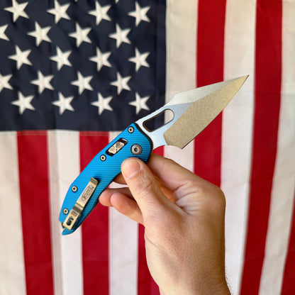 Stitch Ram‑Lok Knife – Blue Fluted Aluminum Handle, M390 MK Blade (Stonewash), RAM‑LOK Bar Lock – Made in USA (MCT18250 / 169RL‑10FLBL)