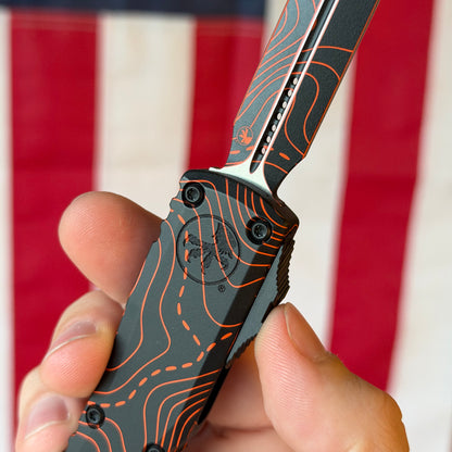 Microtech Ultratech Gen IV OTF - Black and Orange Topographic Camo, M390MK Dagger, Signature Series - Made in USA (11224-1TPBKORCS)