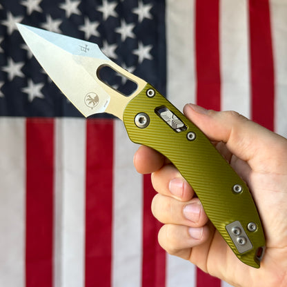 The Back Door: Used - Microtech Stitch RAM-LOK 169RL-10FLOD 3.625" Spear Point, M390MK Stonewash, OD Green Fluted Aluminum, Manual - Made in USA