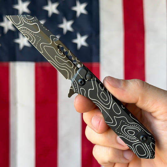 The Back Door: Used - Heretic Jinn Manual H213-TOPO 3.00" Wharncliffe, CPM-MagnaCut DLC, Deep Engraved Topo, Button Lock - Made in USA