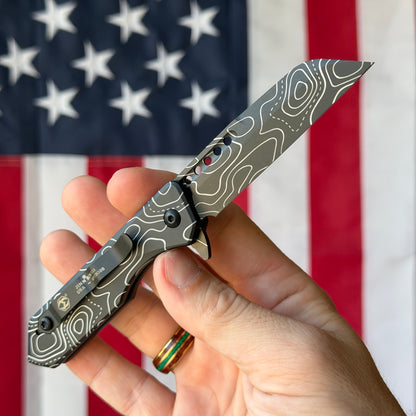 The Back Door: Used - Heretic Jinn Manual H213-TOPO 3.00" Wharncliffe, CPM-MagnaCut DLC, Deep Engraved Topo, Button Lock - Made in USA