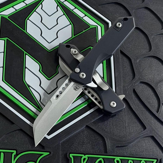 Heretic Jinn Manual 3.0" Button Lock Flipper – Battleworn MagnaCut, Black Chassis – Made in USA (H213-5A)