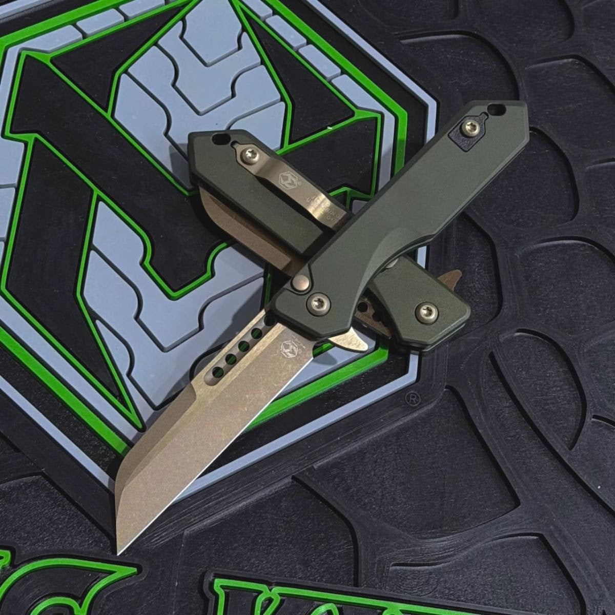 Heretic Jinn Manual 3.0" Button Lock Flipper – Bronze MagnaCut, OD Green Chassis – Made in USA (H213-7AGRN)