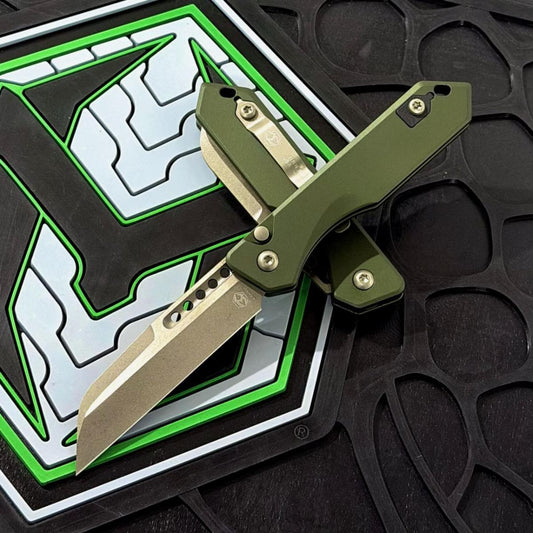 Heretic Jinn Auto 3.0" Button Lock – Bronze MagnaCut, OD Green Chassis, Flat Coil Spring – Made in USA (H113-7AGRN)