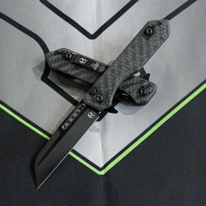 Heretic Knives Jinn Manual 3" Flipper – Glow Carbon Fiber, DLC MagnaCut – Made in USA (H213-6A-GLOCF)
